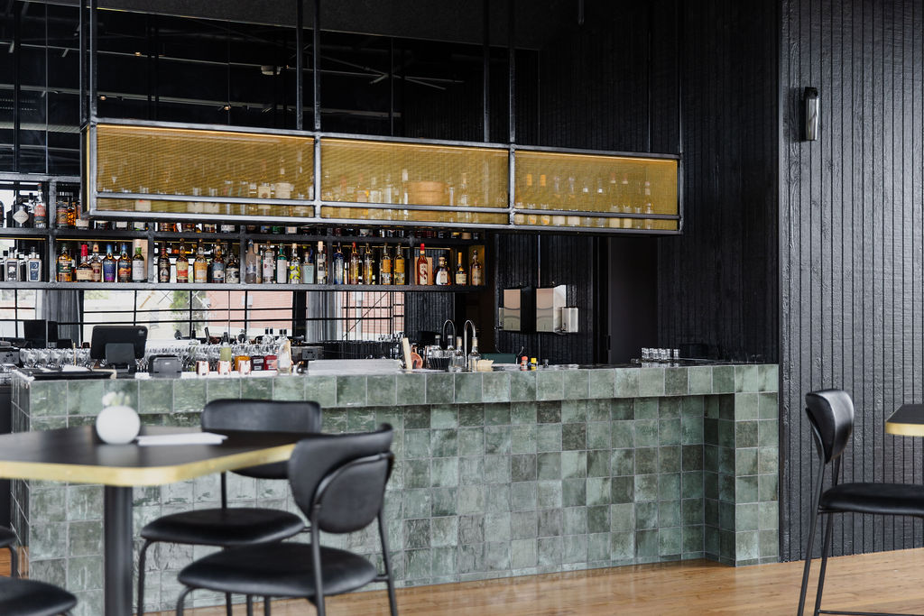 Woolstore Restraunt & Bar in Newtown, Geelong. Photo of upstairs bar and high tables and seats.